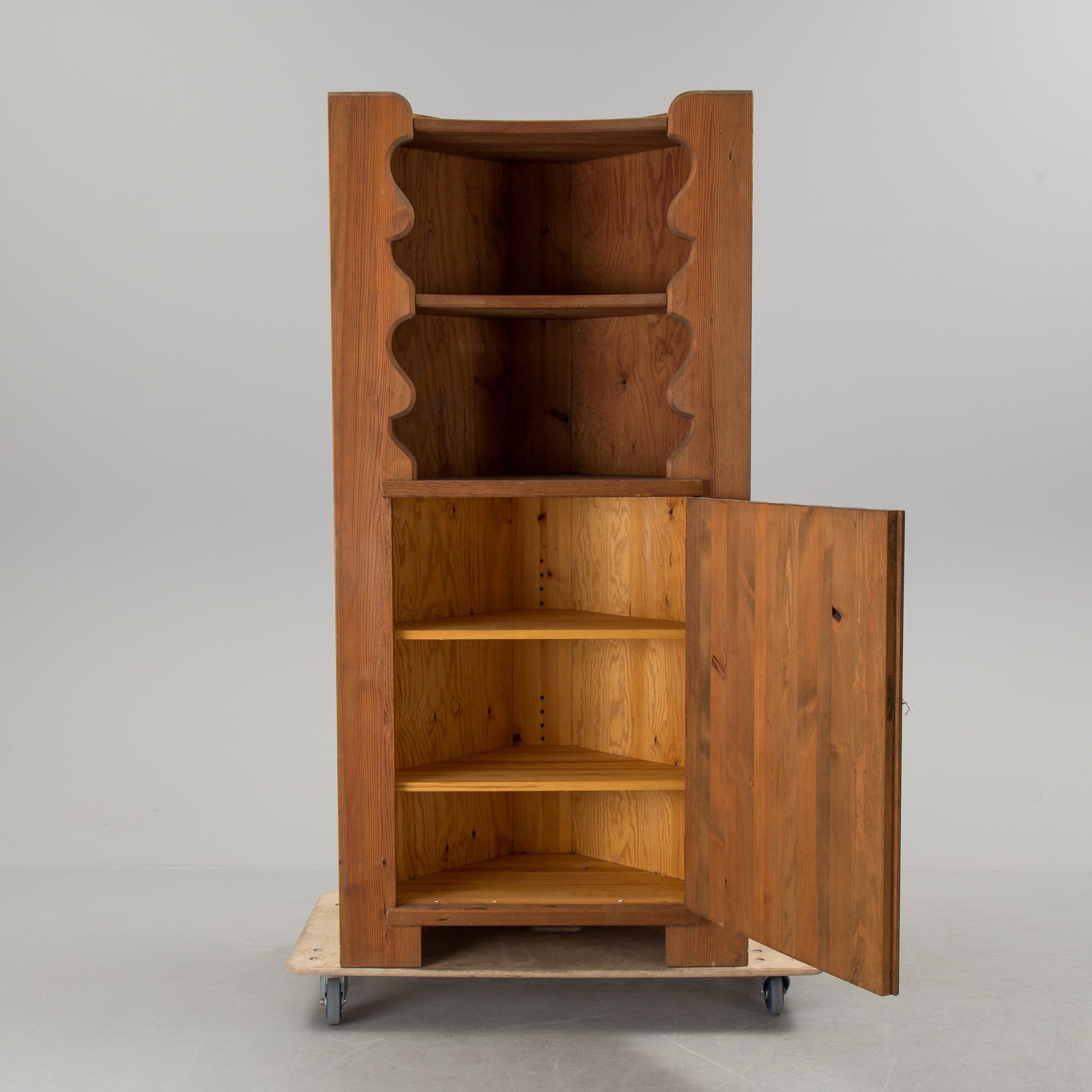 A corner cabinet by Axel Einar Hjorth.