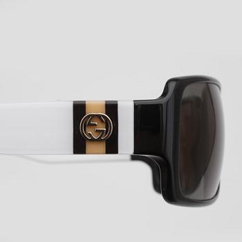 SOLGLASÖGON, Gucci.