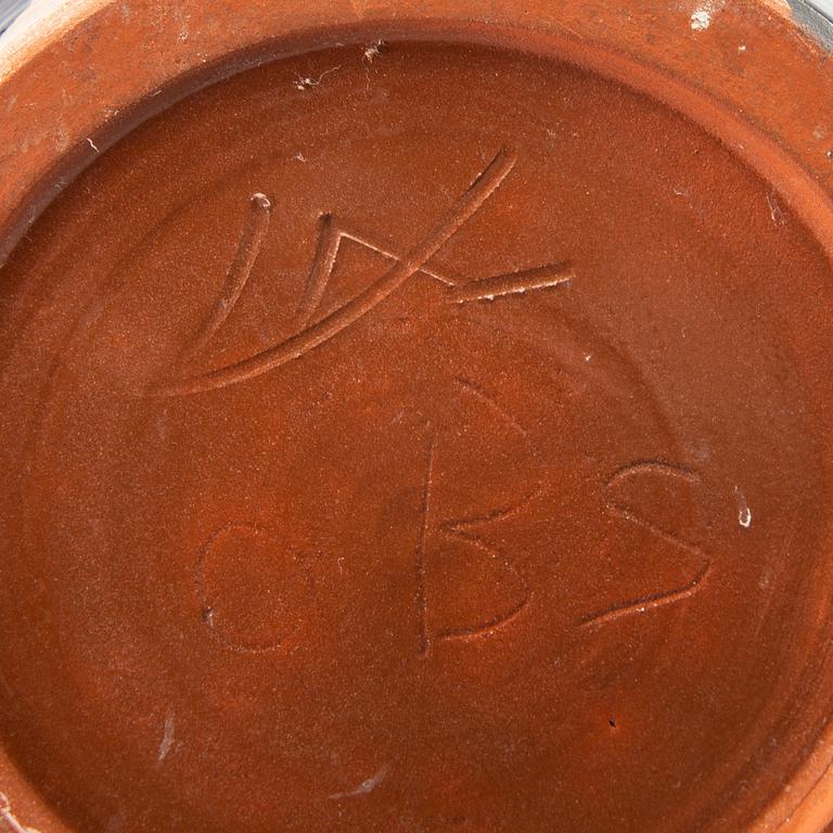 A glazed ceramic vase signed.