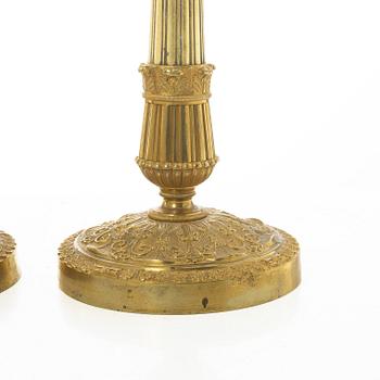 A pair of French Empire candlesticks, early 19th century.