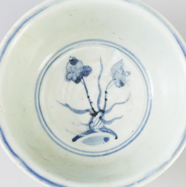 A blue and white Chinese porcelain bowl and two miniature jars for the South East Asian market, probably Ming dynasty.