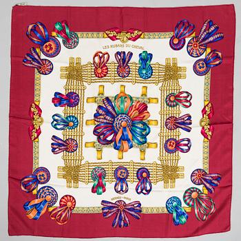 Hermès, a 'Les Rubans du Cheval' silk scarf.
