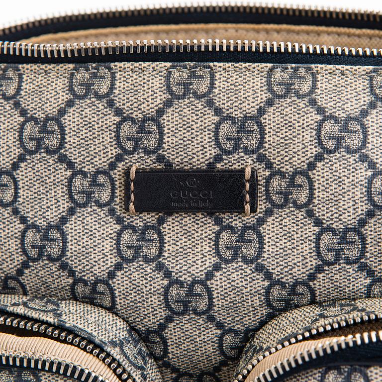 Gucci, A "GG Supreme messenger" bag.