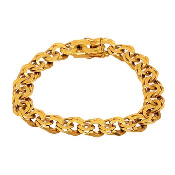 An 18K gold Bismarck bracelet.