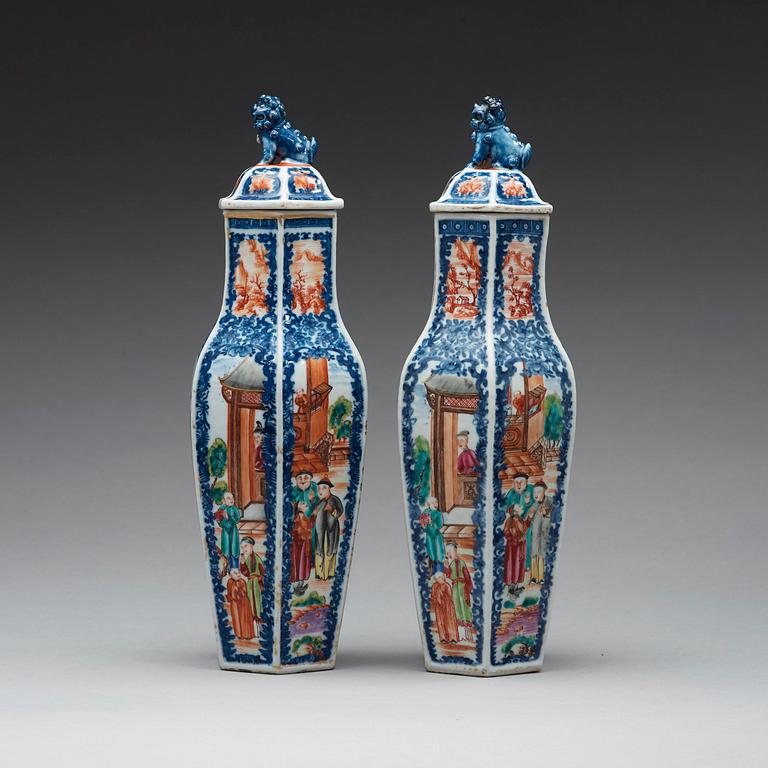 A pair of famille rose and underglaze blue vases with covers, Qing dynasty, Qianlong (1736-95).