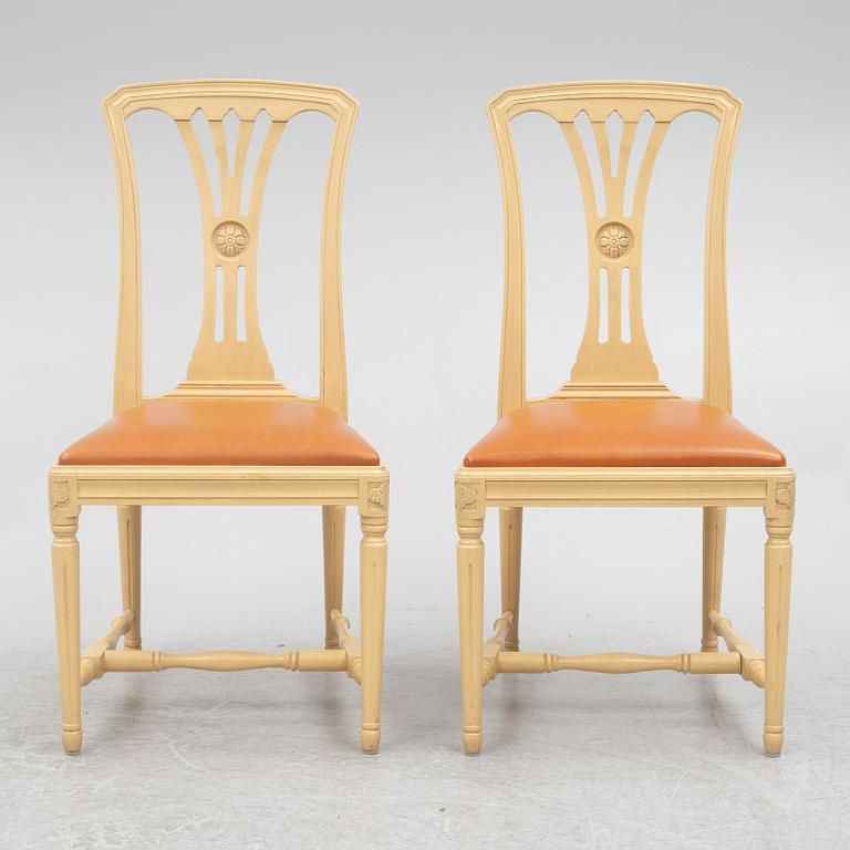 A Gustavian style dining table with six dining chairs, Sweden, 21st century.