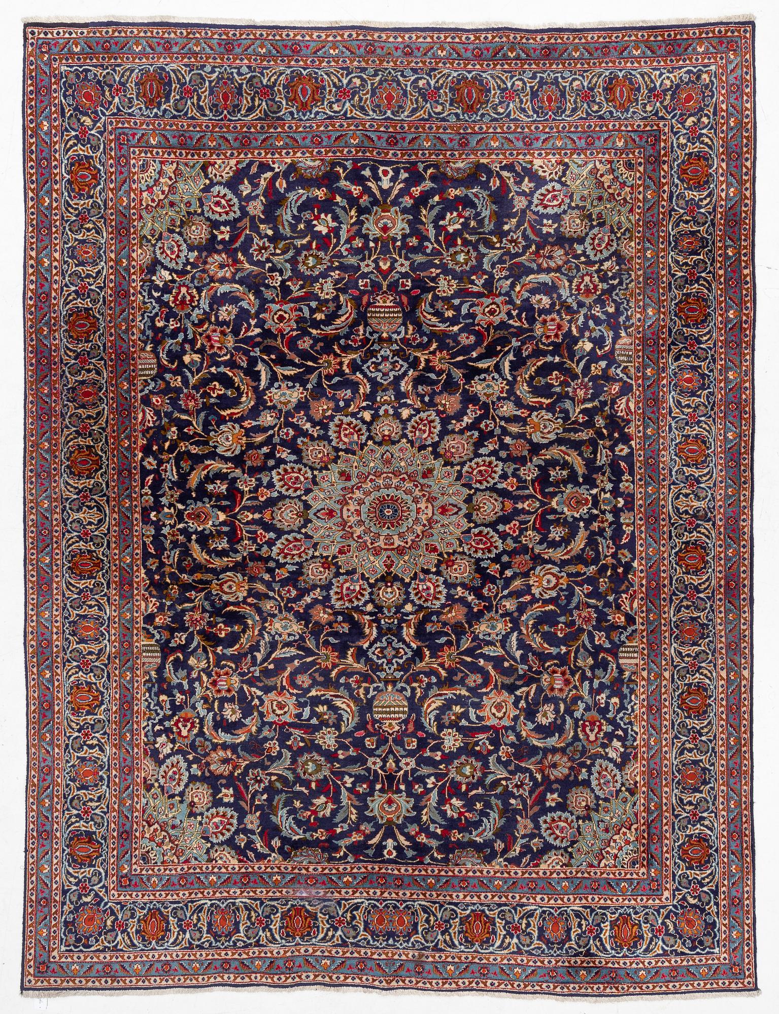 An oriental carpet, c. 390 x 295 cm.