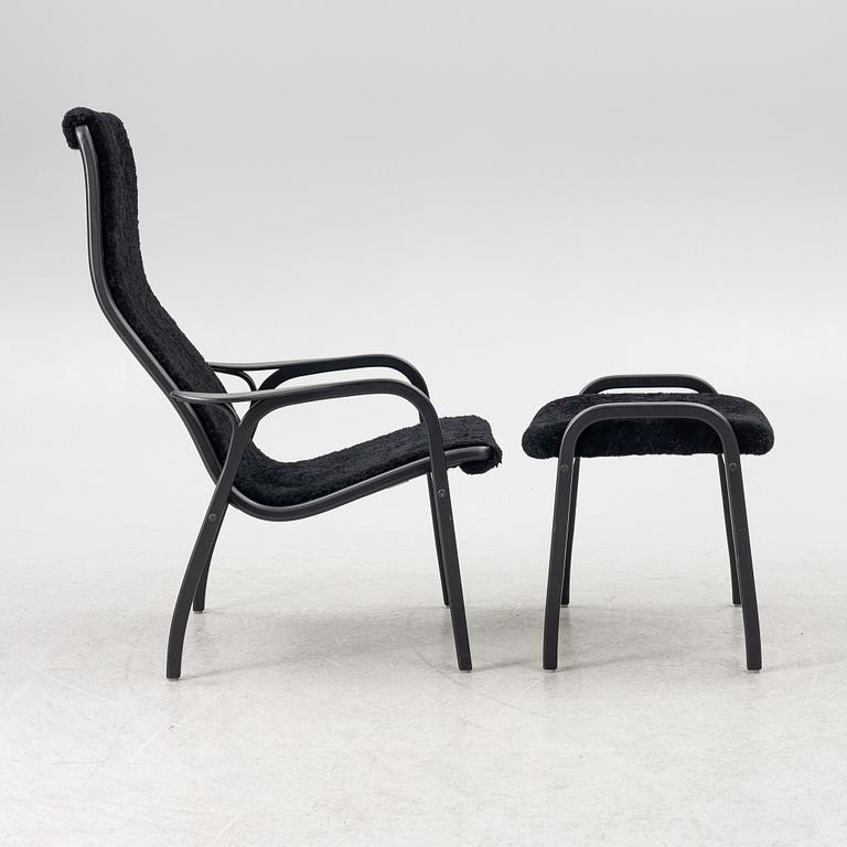 Yngve Ekström, a  'Lamino' easy chair with foot stool, Swedese, 2018.