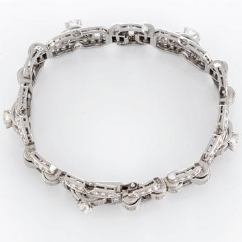 A platinum bracelet set with round brilliant- and eight-cut diamonds.