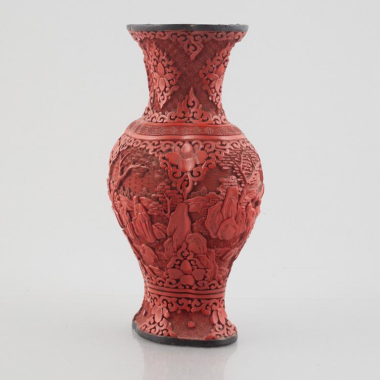 A red laquer vase, early 20th century.