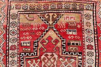 An oriental semi antique carpet, circa 272 x 120 cm.
