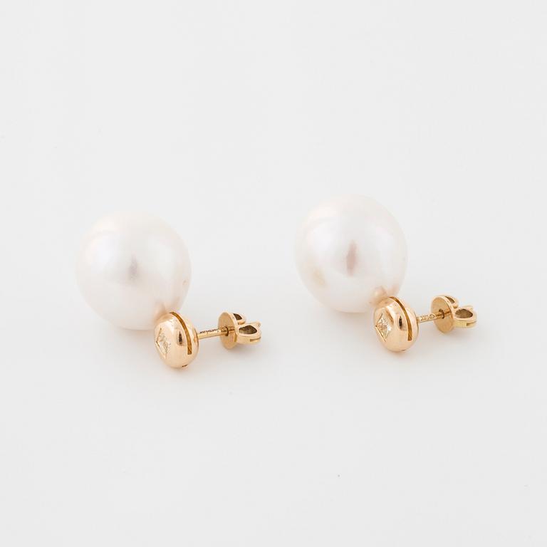 A pair of cultured pearl and princess cut diamond earrings.