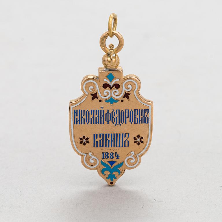A 14K gold and enamel jetton. Moskow.