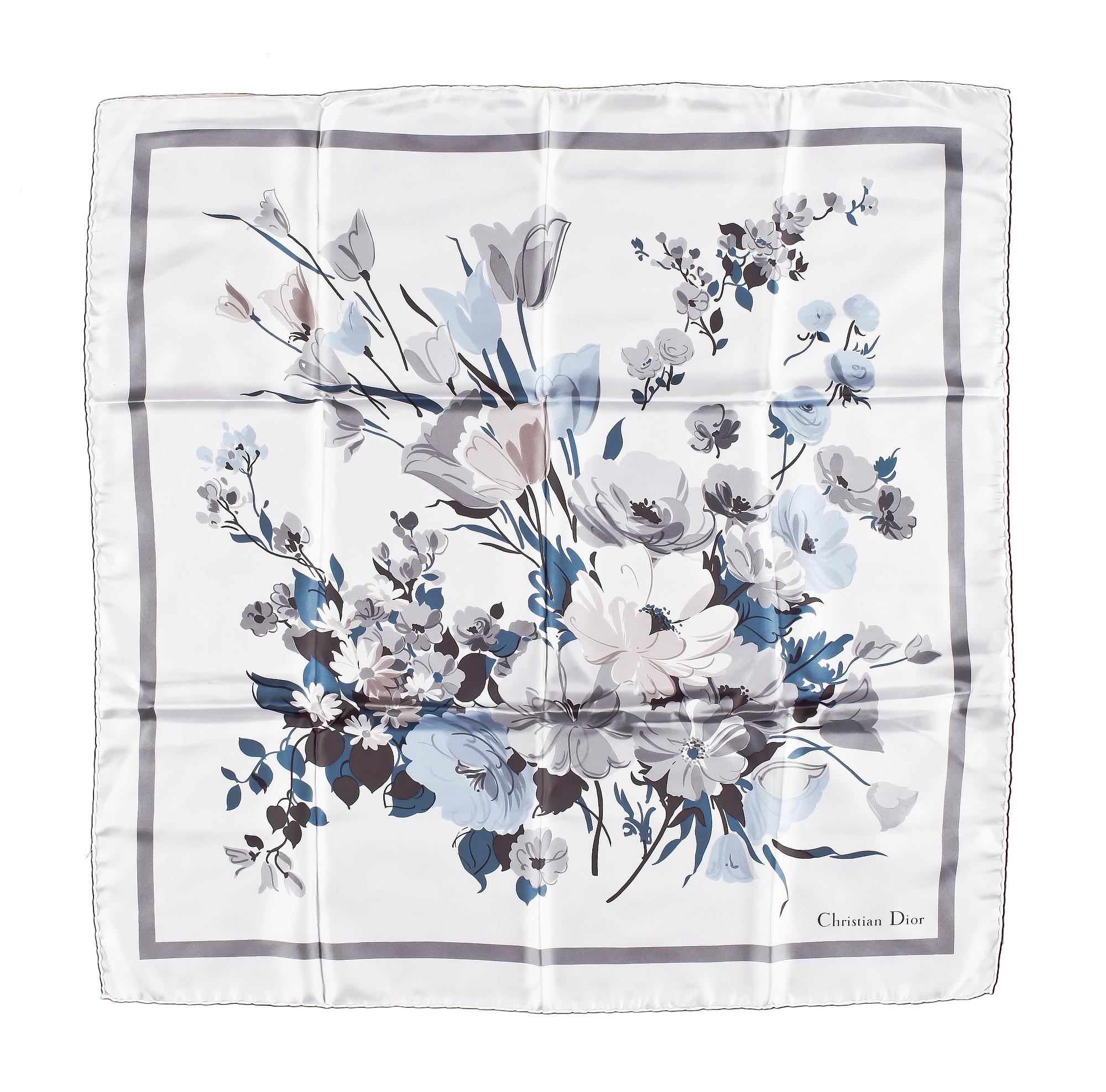 A set of three scarves by Christian Dior, Emilio Pucci and Yves Saint Laurent.
