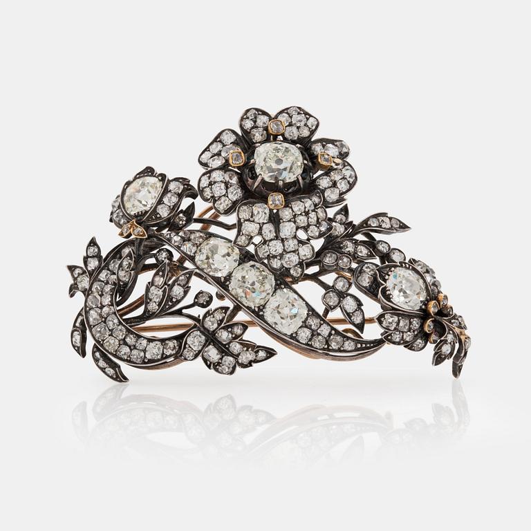 A late 19th century floral brooch set with old cut diamonds, total carat weight circa 10.00 cts.