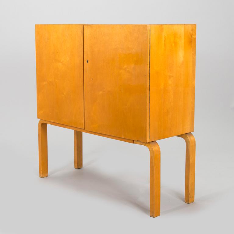 Alvar Aalto, mid-20th century '810' cabinet and a 
'69'chair Oy Huonekalu- ja Rakennustyötehdas Ab.