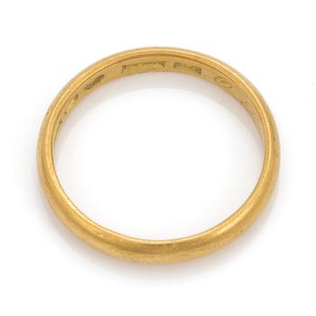 A 23K gold ring.