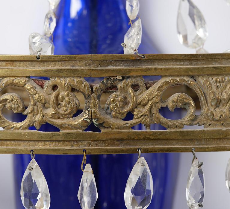A pair of Russian Louis XVI-style  four-branch gilt bronze appliques, 19th century.