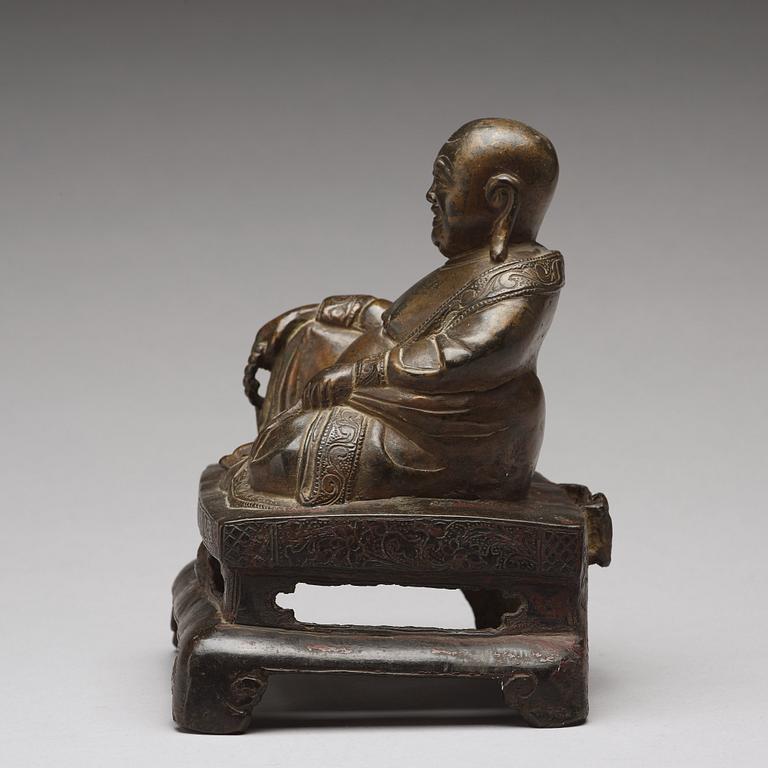 A setated bronze figure of Buddai, Qing dynasty (1664-1912).