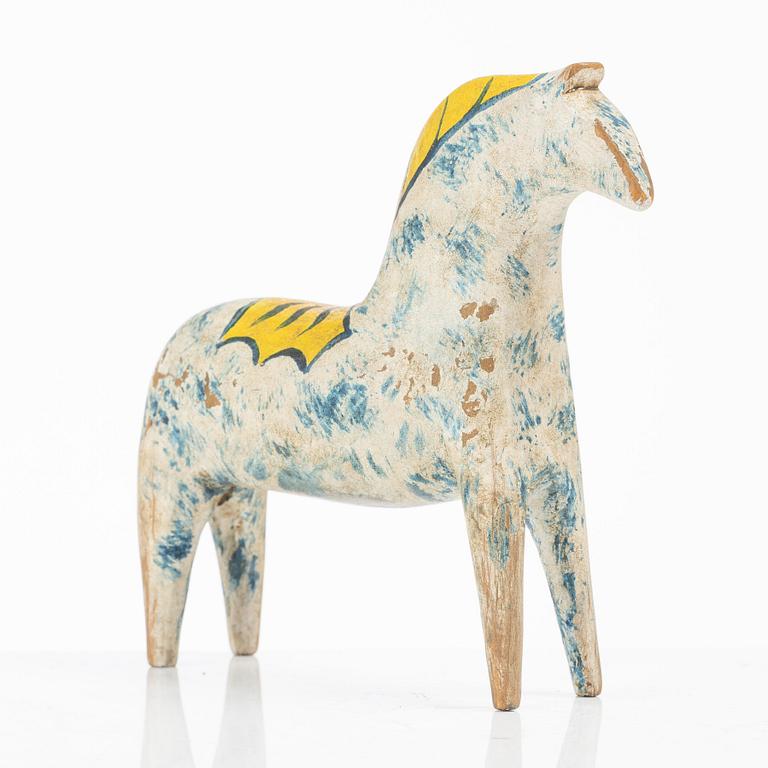 A carved and polychrome painted Dalecarlian horse, circa 1900.