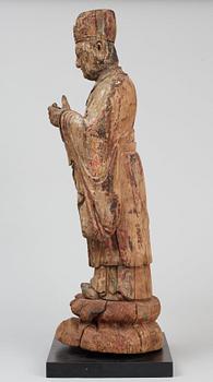 A wooden sculpture of a deity, Ming style.