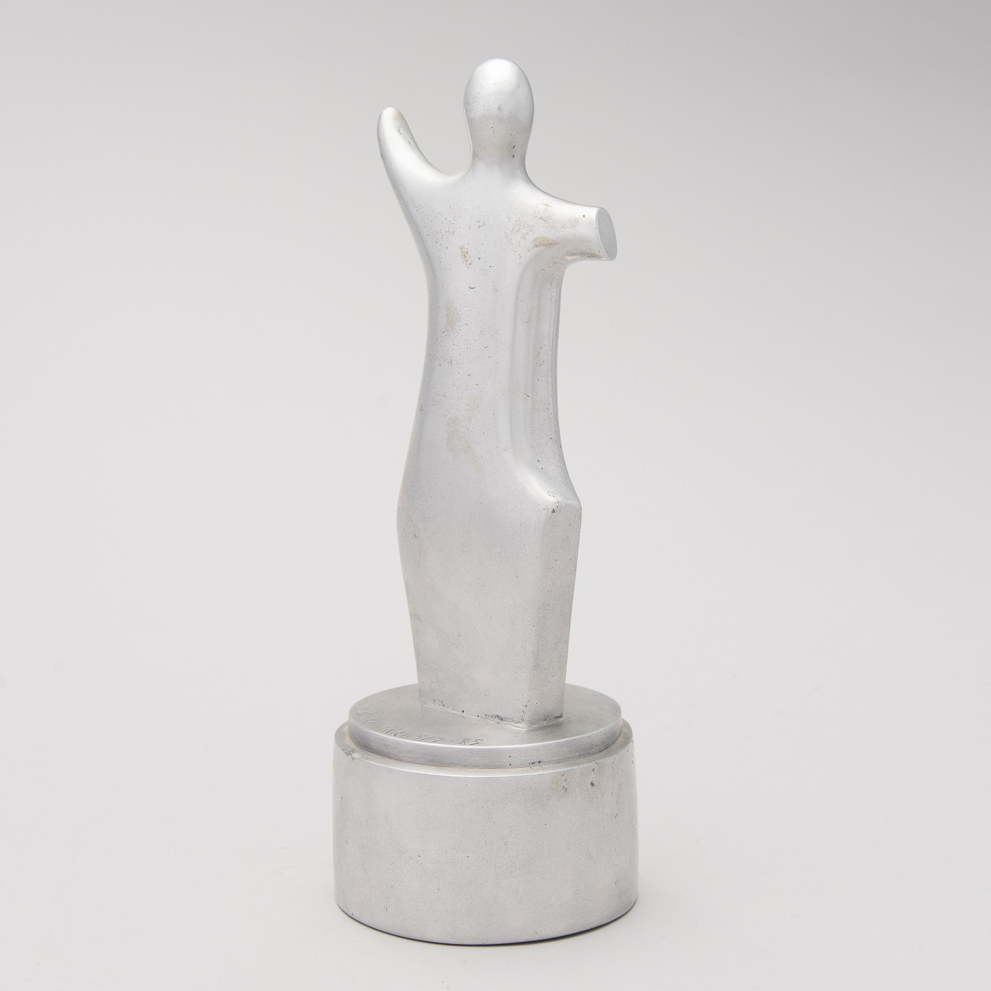 An aluminium sculpture, signed and numbered 5/7, dated -85.