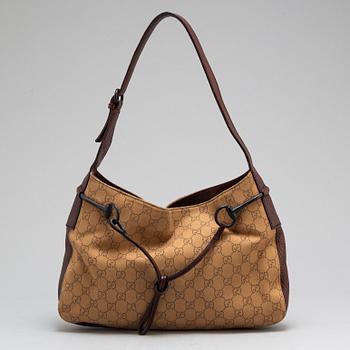 GUCCI, A canvas and leather bag.