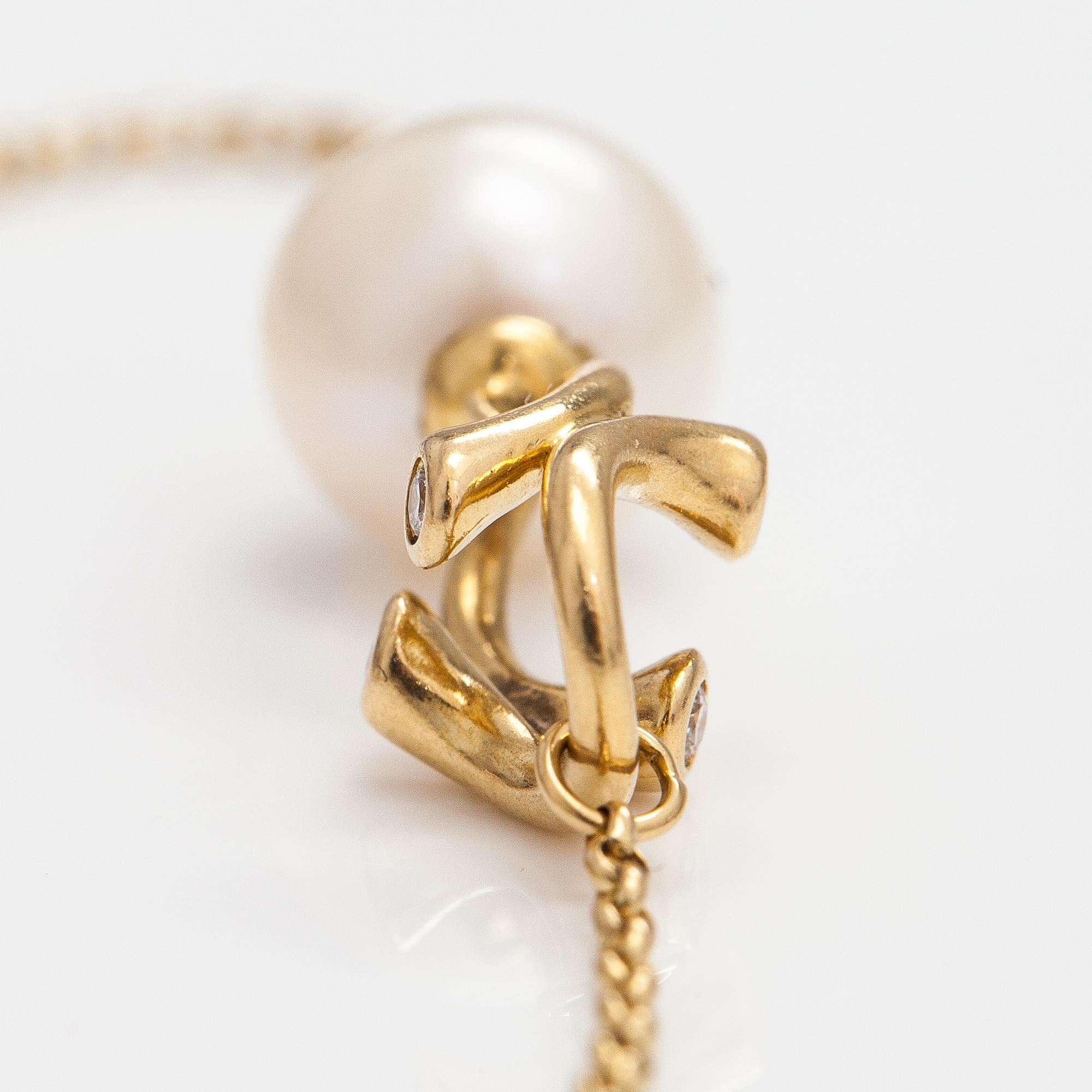 Georg Jensen, An 18K gold bracelet "Magic" with a cultured pearl and diamonds ca. 0.048 ct in total, Denmark.