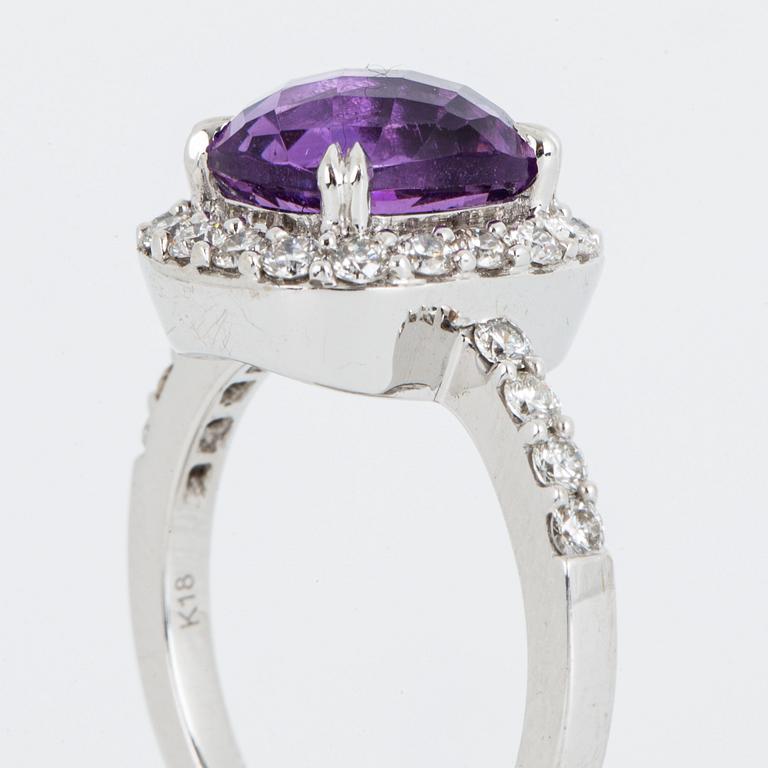 Brilliant-cut diamond and checker-cut amethyst ring.