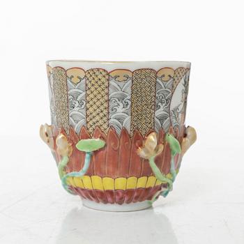 A small Chinese famille rose porcelain tureen with cover and stand, two salt cellars, Qing dynasty, Qianlong (1736-95).