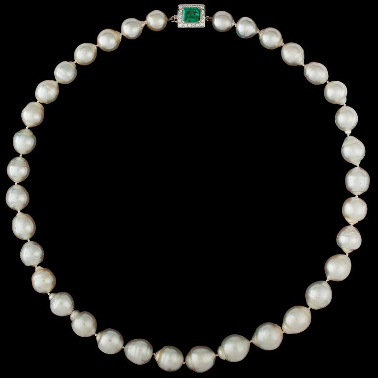 A cultured South sea pearl necklace with emerald and diamond clasp.