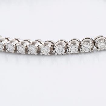TENNISARMBAND 18K vitguld m 54 briljanter ca 3 ct.