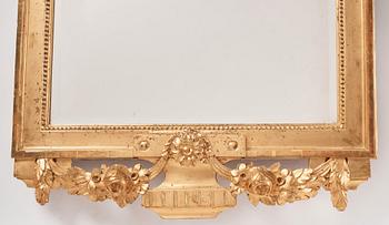 A Gustavian giltwood mirror, late 18th century.