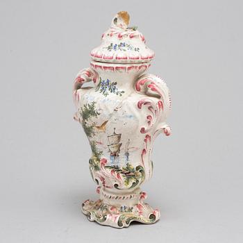 A Rococo faiance vase with cover, mid 18th century.