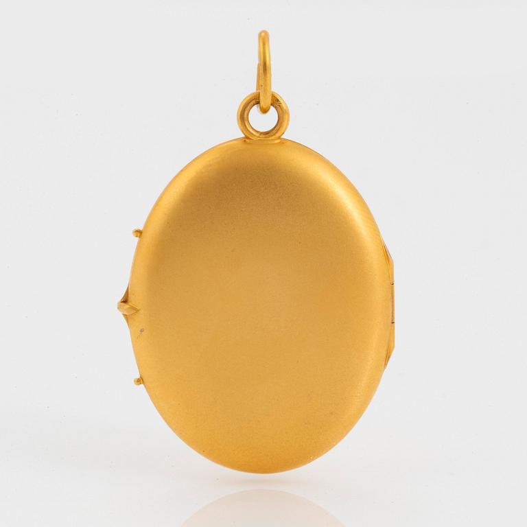 A 14K gold locket.