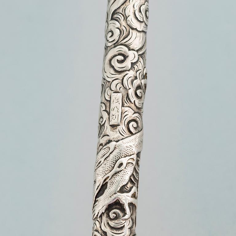 A Japanese silver opium pipe, Meiji period (1868-1912).