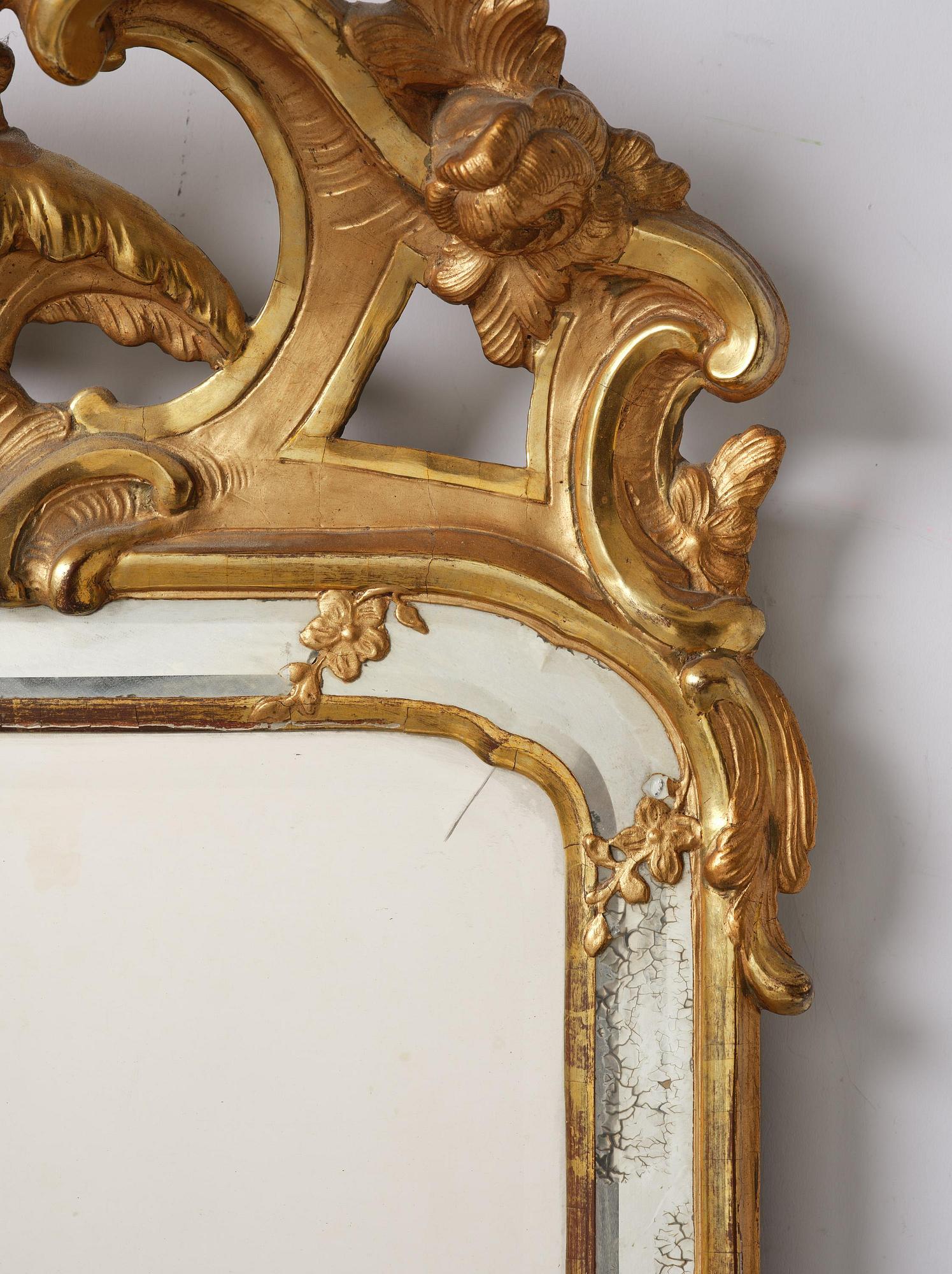 A rococo giltwood mirror, Stockholm, later part 18th century.