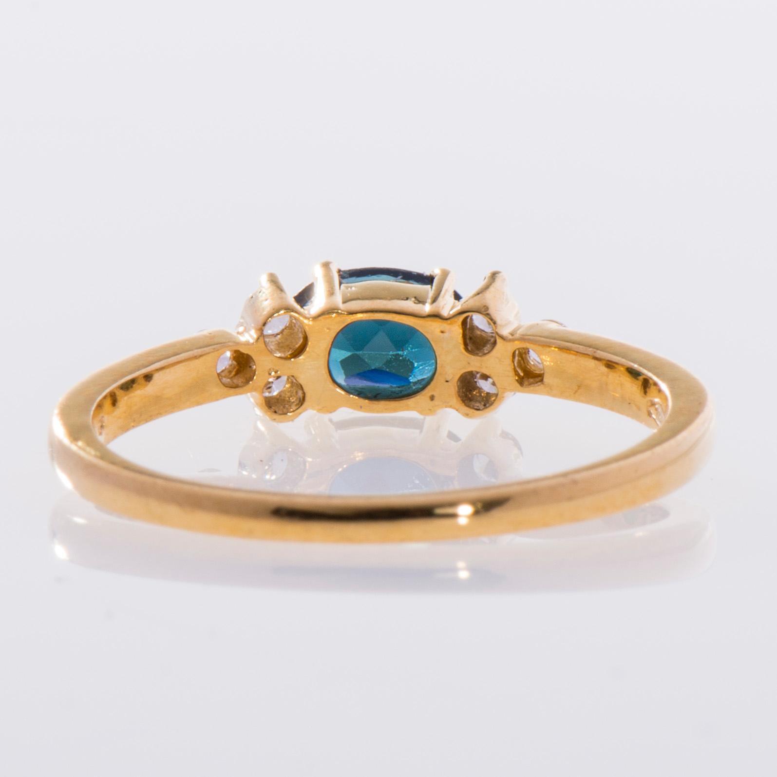 RING, 18K guld, blågrön turmalin ca 0,27 ct samt 6 små diamanter,  finska stämplar. Vikt 2,6 g.