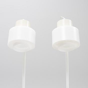 A pair of whithe floor lights, Luxus, Vittsjö.