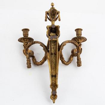 A pair of Louis XVI-style bronze wall sconces, late 19th century.