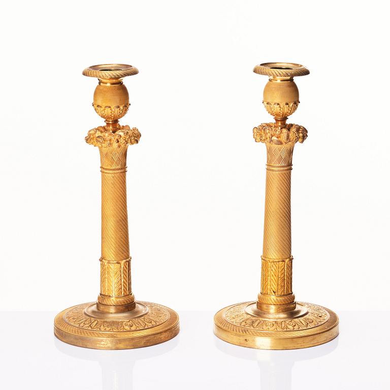 A pair of French Empire candlesticks, early 19th century.