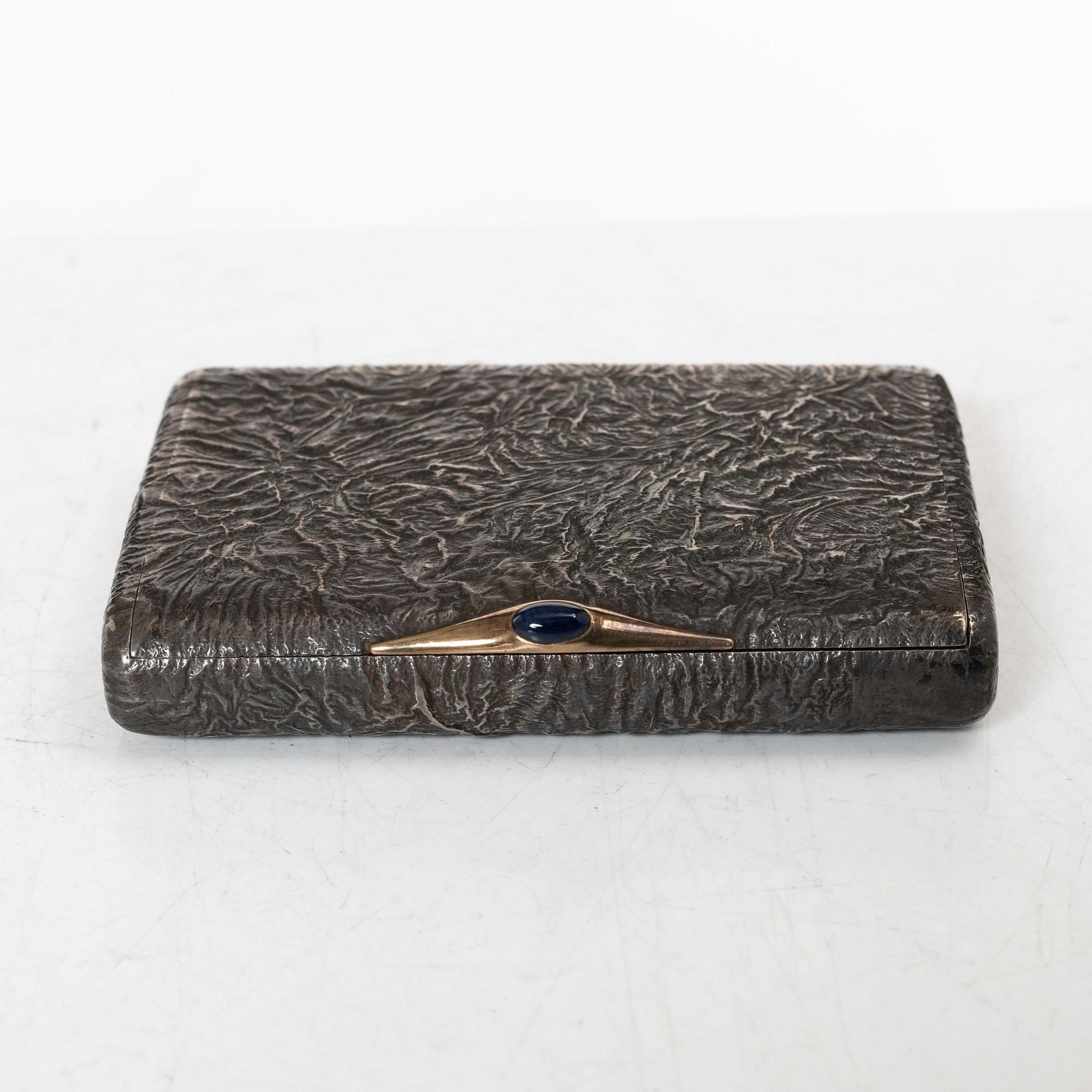 A Russian silver samorodok cigarette case, St. Petersburg 1908-17, unidentified maker's mark, possibly Ivan Arkarov.