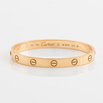 A Cartier "Love" bracelet in 18K gold.