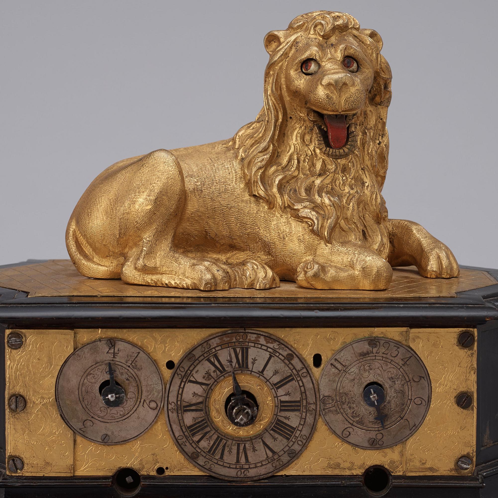 A rare gilt brass on ebonised base Lion Automaton figure clock, Augsburg circa 1630.