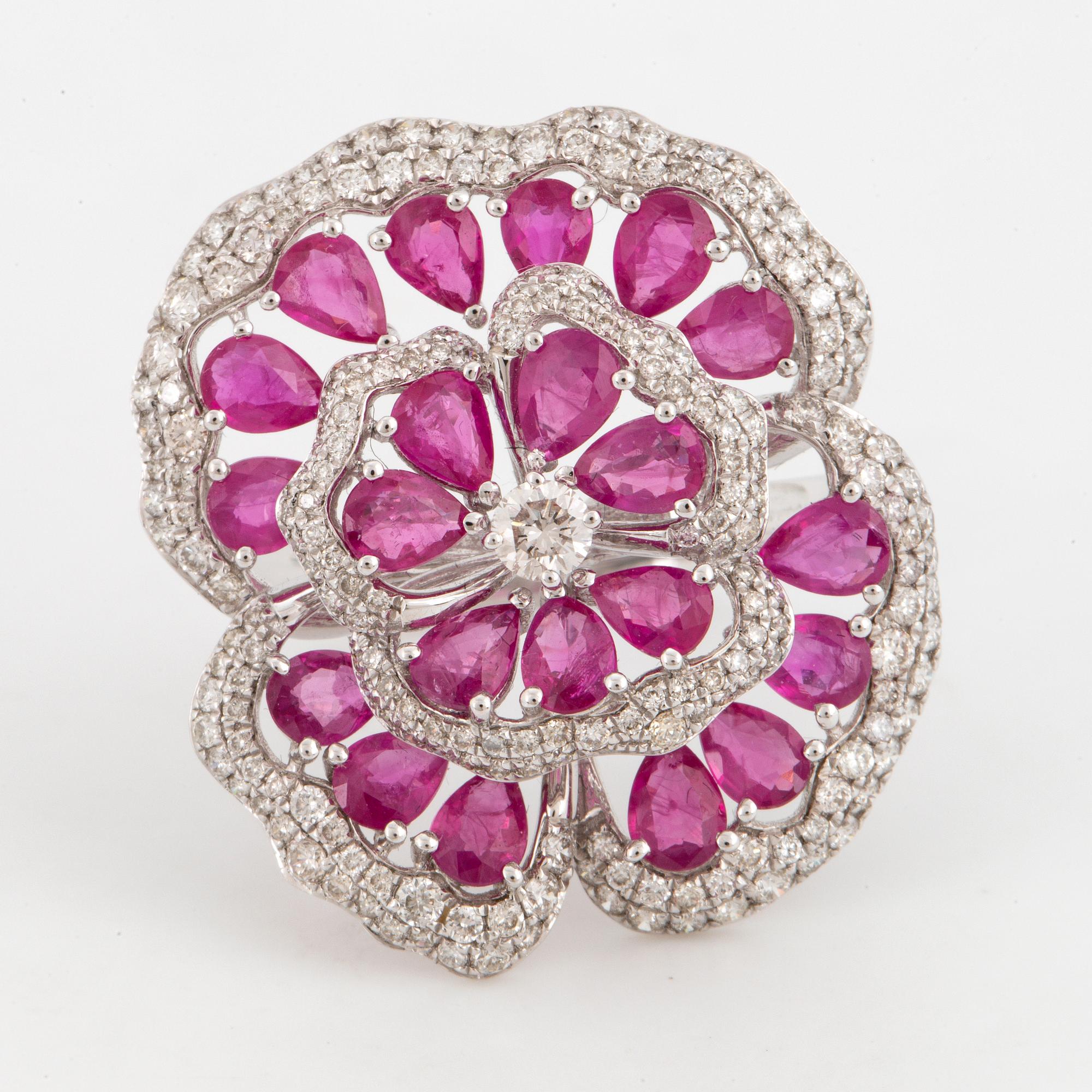 Ruby and brilliant-cut diamond flower ring.