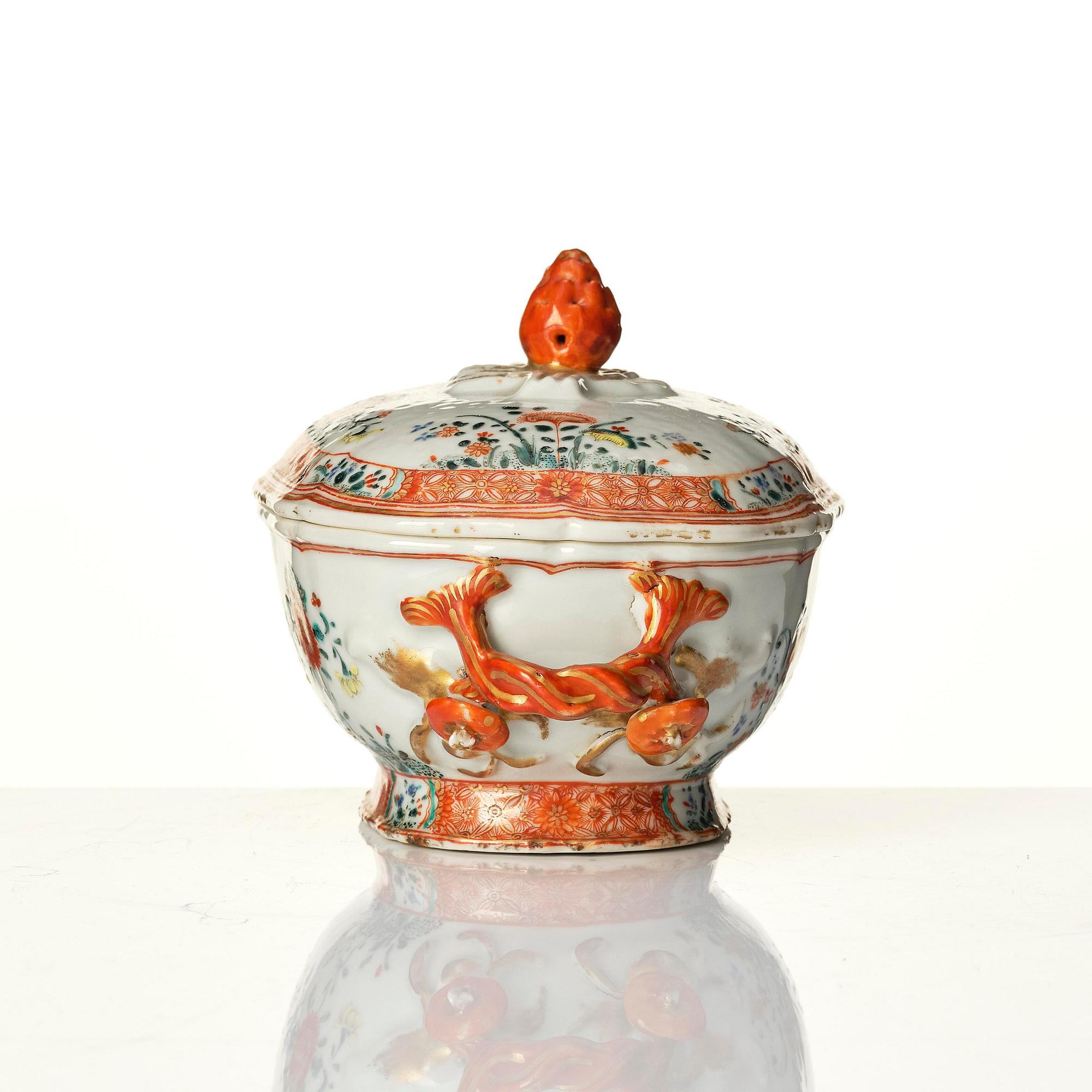 A famille rose butter tureen with cover and stand, Qing dynasty, 18th century.