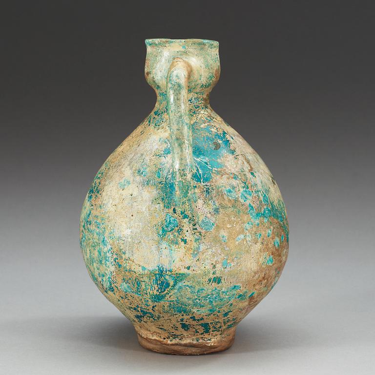 EWER, pottery. Turquoise glaze. Persia 13th century, probably Kashan.