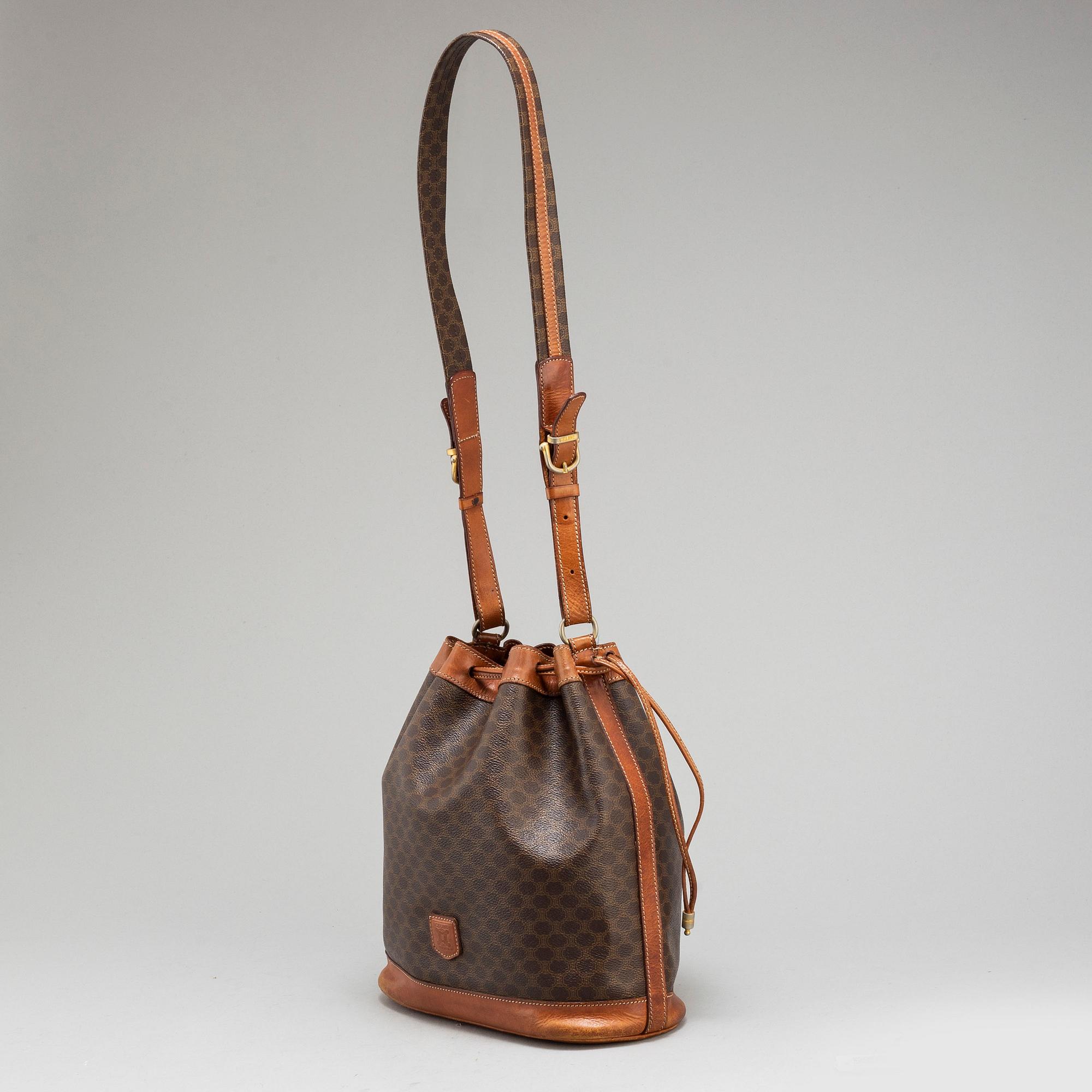 CELINE a monogram canvas bucket bag. Bukowskis