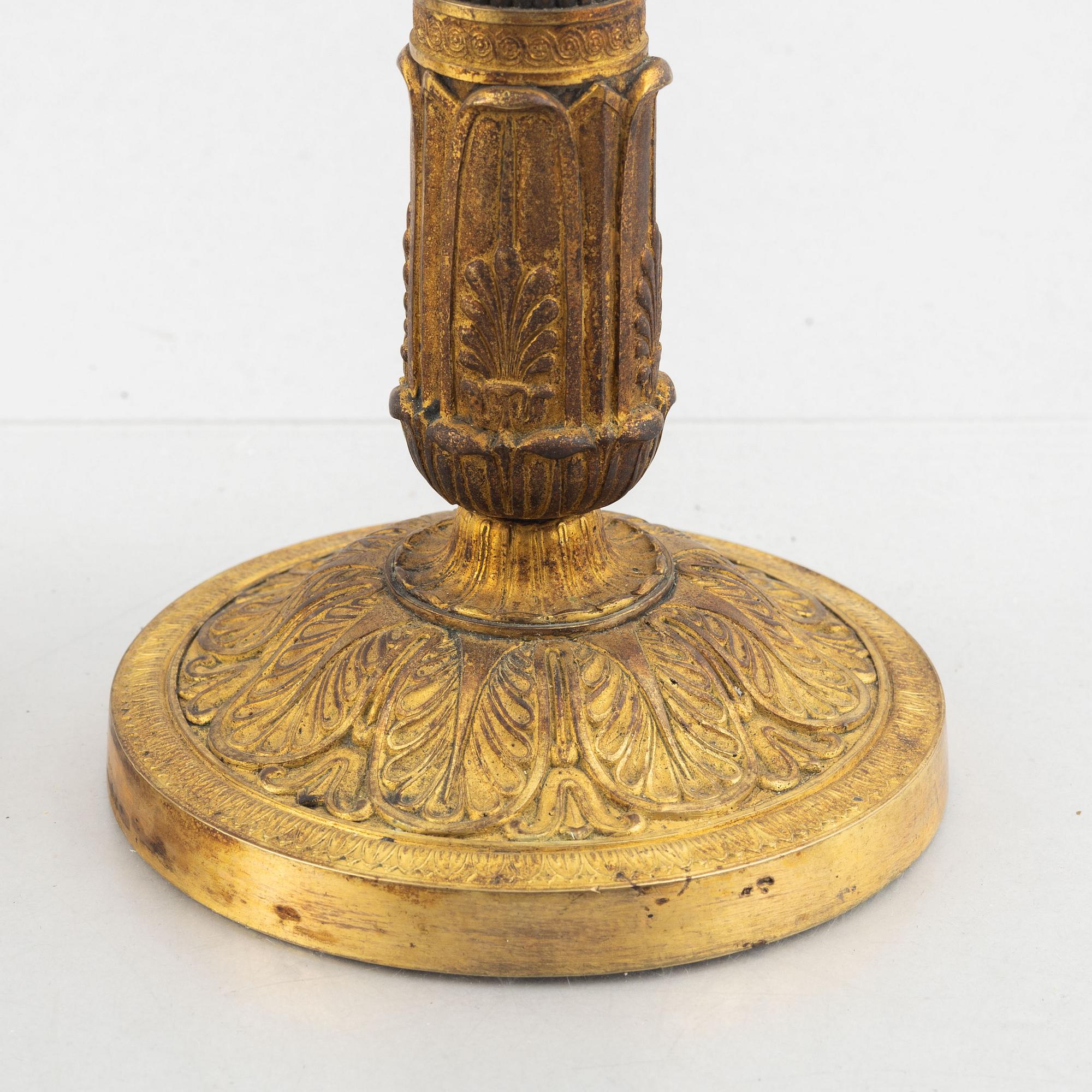 A pair of Empire candle sticks, 19th century.