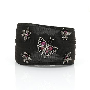 ARMBAND, rostfritt svart stål, rubiner och små diamanter.